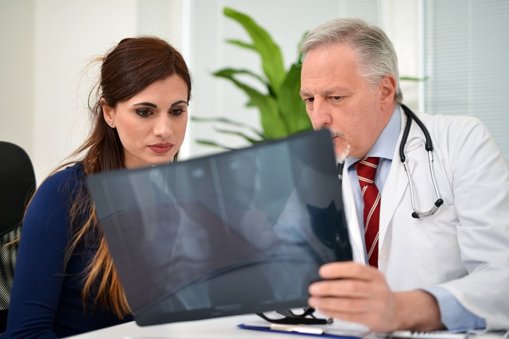 patient and doctor with x-ray